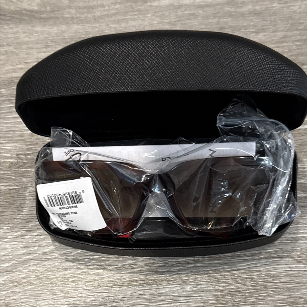 Salvatore Ferragamo Tortoise Sunglasses with SF Logo at Temples.